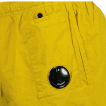 Load image into Gallery viewer, Cp Company Flatt Nylon Lens Swim Shorts in Golden Nugget
